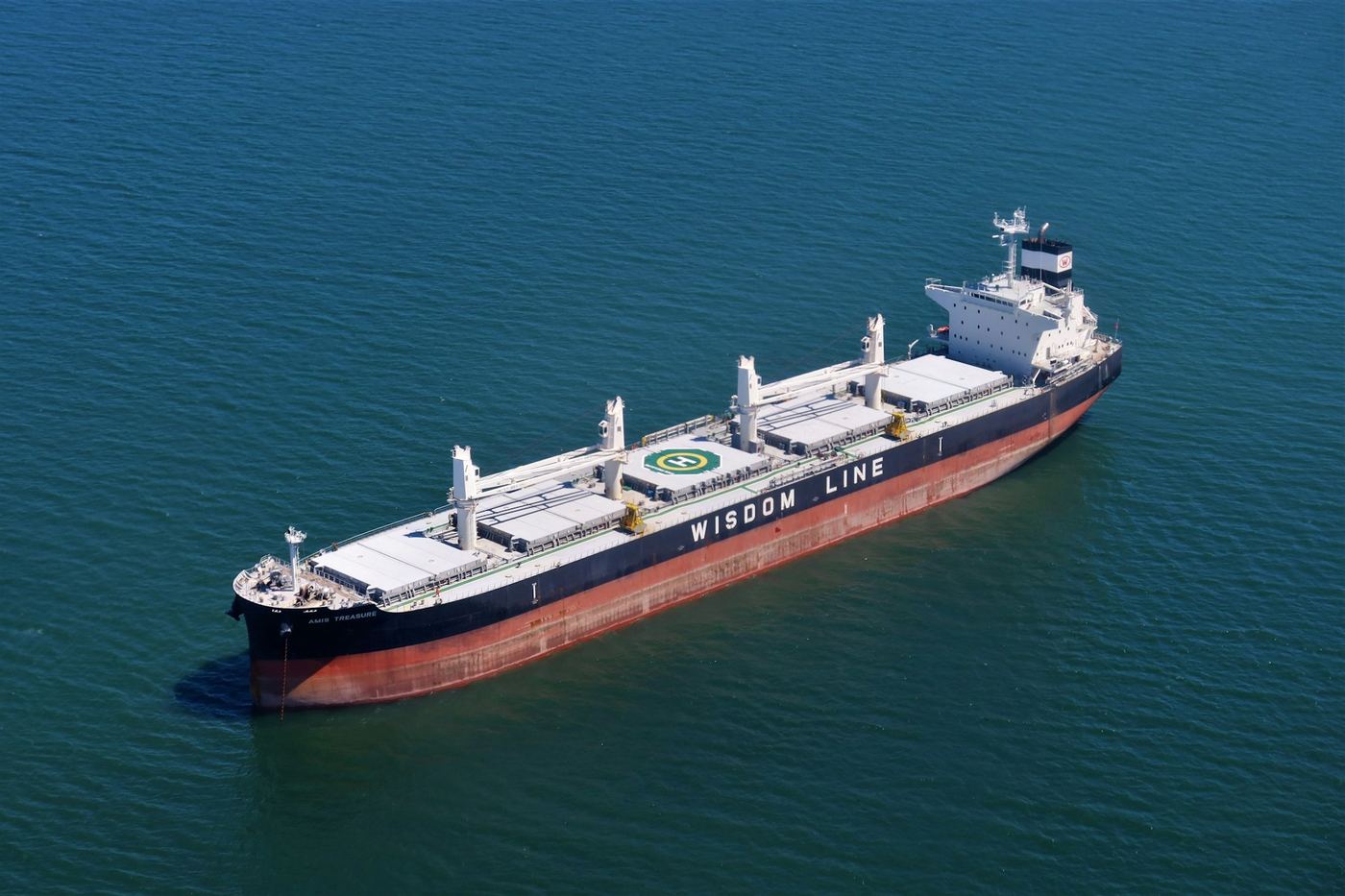 Aerial view of a cargo vessel surrounded by open water